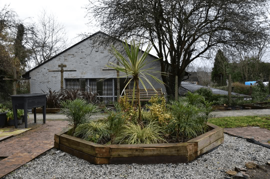 Honicknowle Community Gardens with a planter made from timber donated by Richard Harding Construction