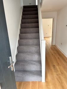 grey carpet fitted on stairs of new build property